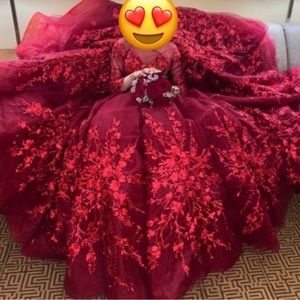 Custom made in Turkey red engagement dress.
Fits a size 2-4 & only worn for